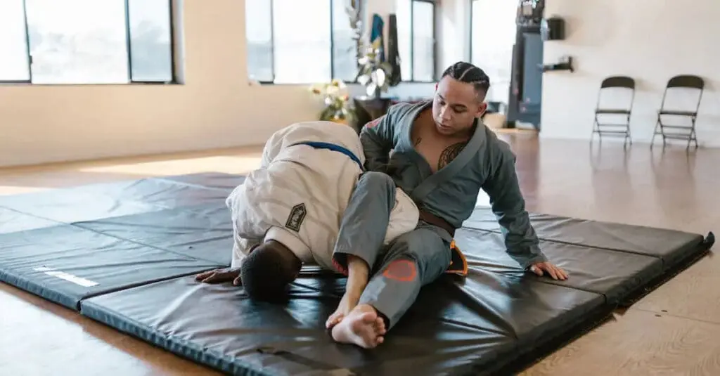 Two Brazilian Jiu Jitsu students practicing a positional drill on the mat, focusing on BJJ positions for beginners.